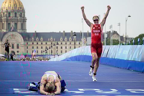 Julie Derron celebrates winning the silver medal